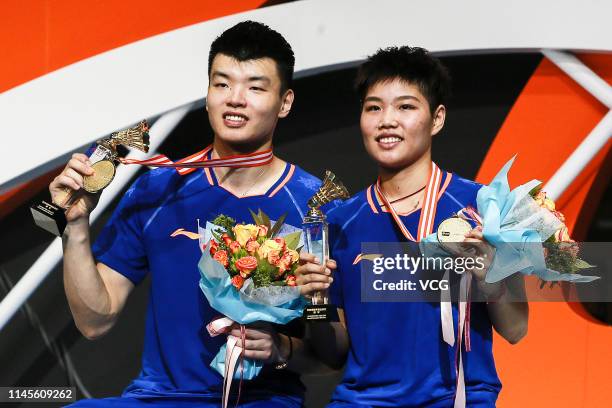 Huang Dongping and Wang Yilyu of China celebrate after the Mixed Doubles final match against He Jiting and Du Yue of China on day six of the Asian...