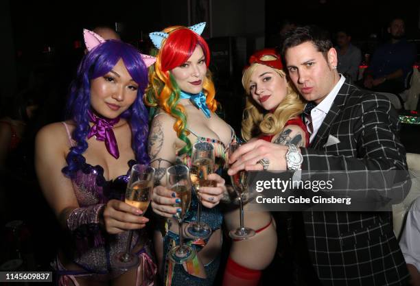 Cosplay models Gaius Cosplay, Dangrrr Doll, Poisonne and producer Dave Bryant make a champagne toast during Larry Flynt's Hustler Club The Gamer...