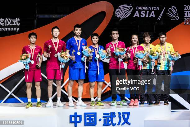 Huang Dongping and Wang Yilyu of China pose after the Mixed Doubles final match against He Jiting and Du Yue of China on day six of the Asian...