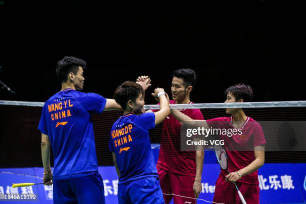 He Jiting and Du Yue of China and Huang Dongping and Wang Yilyu of China react in the Mixed Doubles final match on day six of the Asian Badminton...