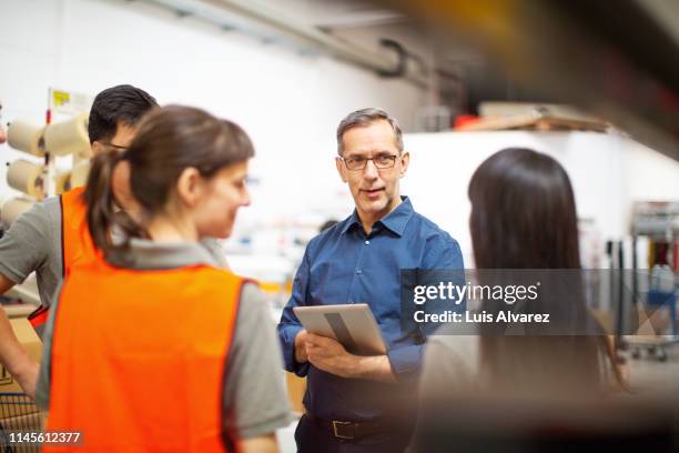 warehouse team meeting - facility manager stock pictures, royalty-free photos & images