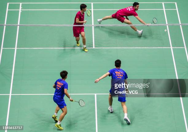 He Jiting and Du Yue of China and Huang Dongping and Wang Yilyu of China react in the Mixed Doubles final match on day six of the Asian Badminton...
