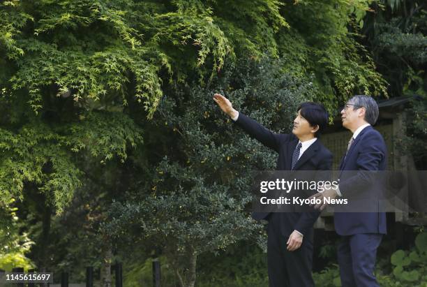 Japanese Crown Prince Fumihito visits the Tohoku University Botanical Gardens in Sendai in Miyagi Prefecture, northwestern Japan, on May 23, 2019....