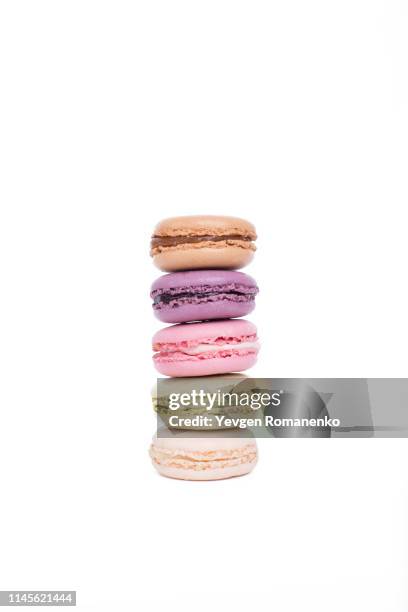 tower of colorful macaroons or macarons dessert isolated on white background - macaroon photos et images de collection