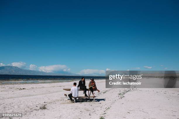 friends relaxing by salton sea in california - coachella outfit stock pictures, royalty-free photos & images