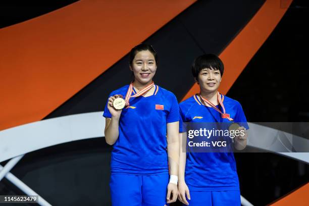 Jia Yifan and Chen Qingchen of China pose after winning the Women's Doubles final match against Mayu Matsumoto and Wakana Nagahara of Japan on day...