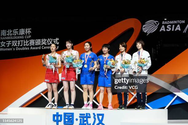 Jia Yifan and Chen Qingchen of China and Mayu Matsumoto and Wakana Nagahara of Japan pose after the Women's Doubles final match on day six of the...