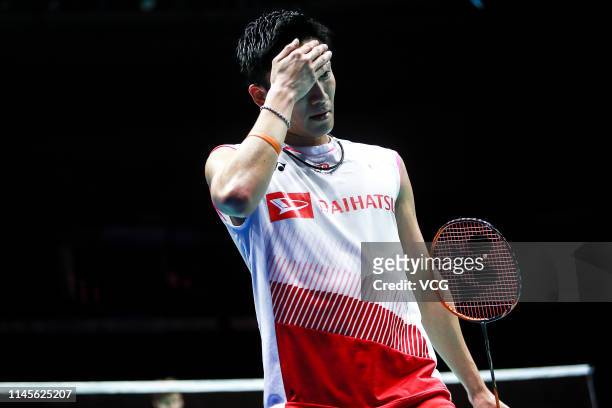 Kento Momota of Japan reacts in the Men's Singles final match against Shi Yuqi of China on day six of the Asian Badminton Championship 2019 at Wuhan...