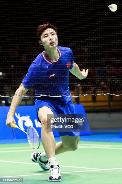 Shi Yuqi of China competes in the Men's Singles final match against Kento Momota of Japan on day six of the Asian Badminton Championship 2019 at...