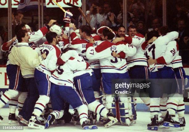 The Montreal Canadiens meet on the ice to celebrate their Stanley Cup victory 09 June 1993. The Canadiens won their 24th Stanley Cup championship by...