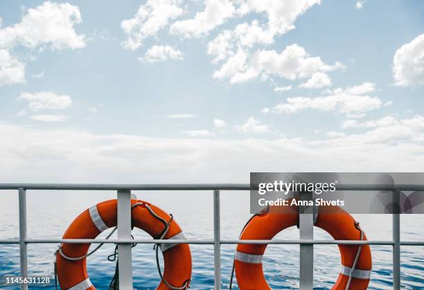 lifebuoys on the background of the sea and sky - bateau croisiere photos et images de collection