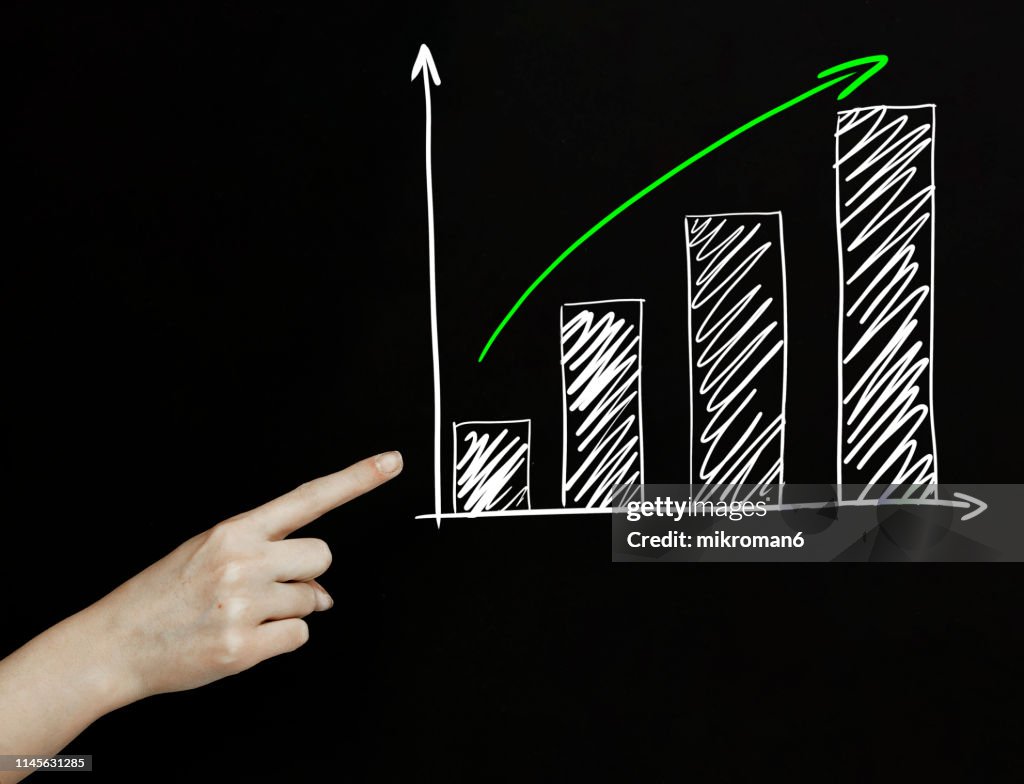 Finger Pointing On A Graph With An Arrow High-Res Stock Photo - Getty ...