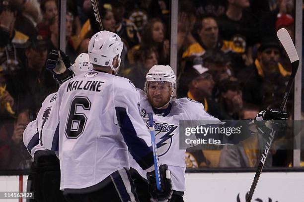 Simon Gagne celebrates his first period goal with Steven Stamkos and Ryan Malone of the Tampa Bay Lightning in Game Five of the Eastern Conference...