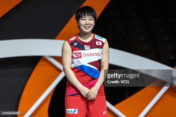 Akane Yamaguchi of Japan celebrates after winning the Women's Singles final match against He Bingjiao of China on day six of the Asian Badminton...
