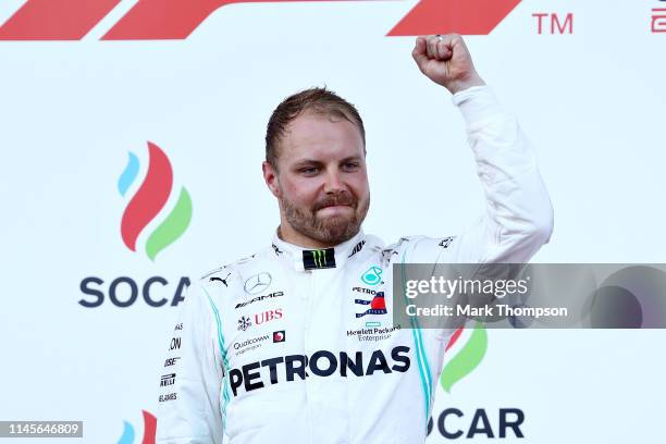 Race winner Valtteri Bottas of Finland and Mercedes GP celebrates on the podium during the F1 Grand Prix of Azerbaijan at Baku City Circuit on April...