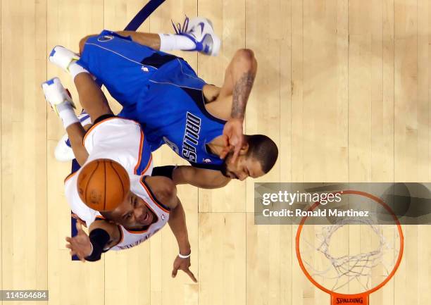 Russell Westbrook of the Oklahoma City Thunder goes up for a shot against Tyson Chandler of the Dallas Mavericks in the first half in Game Four of...