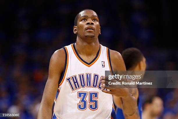 Kevin Durant of the Oklahoma City Thunder looks on in the third quarter while taking on the Dallas Mavericks in Game Four of the Western Conference...