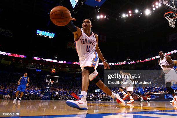 Russell Westbrook of the Oklahoma City Thunder attempts to save the ball from going out of bounds in the third quarter while taking on the Dallas...