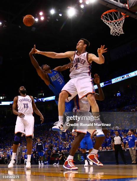 Jason Terry of the Dallas Mavericks goes up for a shot against Nick Collison of the Oklahoma City Thunder in the second half in Game Four of the...