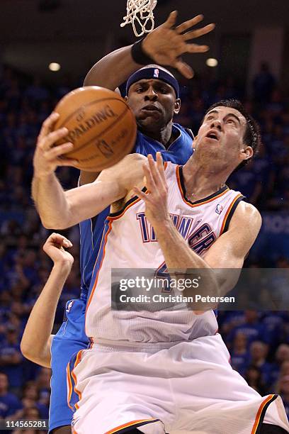 Nick Collison of the Oklahoma City Thunder looks to shoot against Brendan Haywood of the Dallas Mavericks in the second half in Game Four of the...