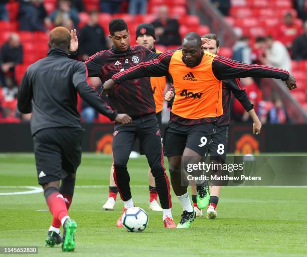 Marcus Rashford and Romelu Lukaku of Manchester United warm up ahead of the Premier League match between Manchester United and Chelsea FC at Old...