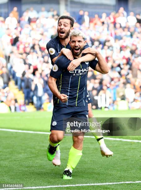 Sergio Aguero of Manchester City celebrates after scoring his team's first goal with Bernardo Silva during the Premier League match between Burnley...