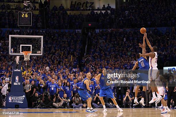 Kevin Durant of the Oklahoma City Thunder has his three-point attempt blocked by Shawn Marion of the Dallas Mavericks with 2.6 seconds remaining in...