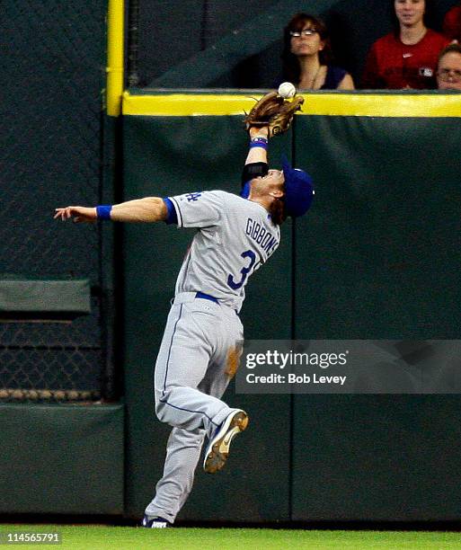 Right fielder Jay Gibbons of the Los Angeles Dodgers misses a fly ball by Bill Hall of the Houston Astros at Minute Maid Park on May 23, 2011 in...