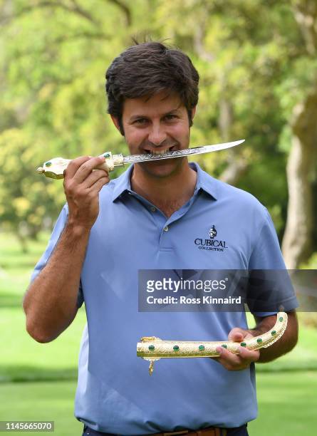 Jorge Campillo of Spain poses for a photo with the trophy after winning the Trophee Hassan II during Day Four of the Trophee Hassan II at Royal Golf...