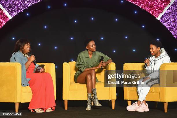 Christina Brown, Flaviana Matata and Gracie J. Speak on stage during the 2019 ESSENCE Beauty Carnival Day 2 on April 28, 2019 in New York City.