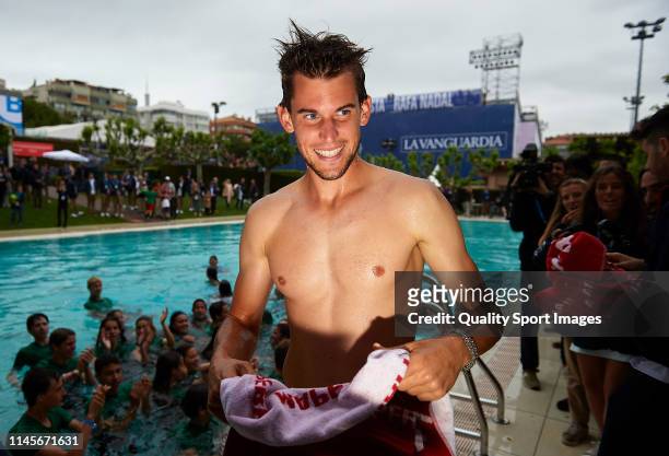 Dominic Thiem of Austria celebrates his win on the swimming pool after defeating Daniil Medvedev of Russia during the final match on day seven of the...