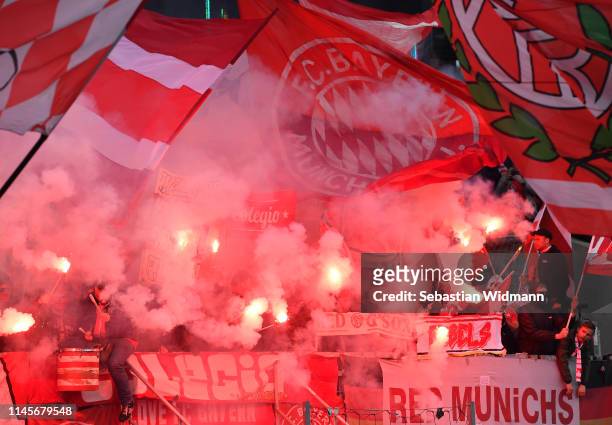 Fans of Muenchen light flairs and wave flags during the Bundesliga match between 1. FC Nuernberg and FC Bayern Muenchen at Max-Morlock-Stadion on...
