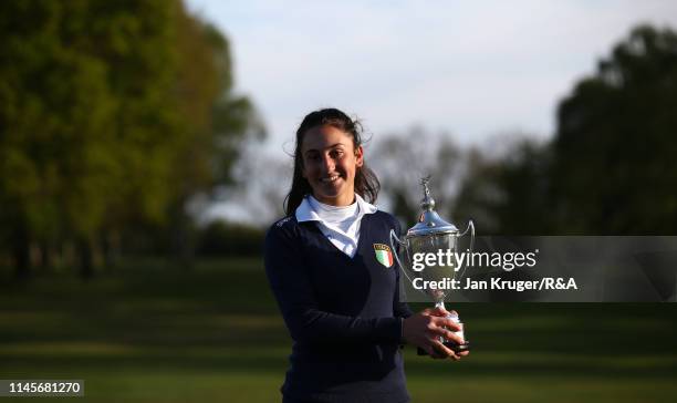 Francesca Fiorellini of Italy poses with the winners trophy following victory during the final round of the R&A Girls U16 Amateur Championship at...