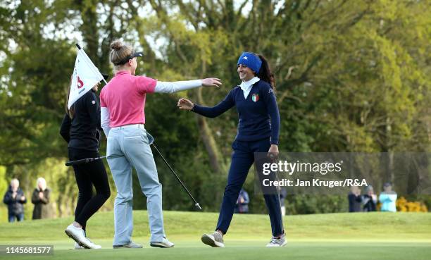 Francesca Fiorellini of Italy is congratulated on the 18th by playing partner Maggie Whitehead during the final round of the R&A Girls U16 Amateur...