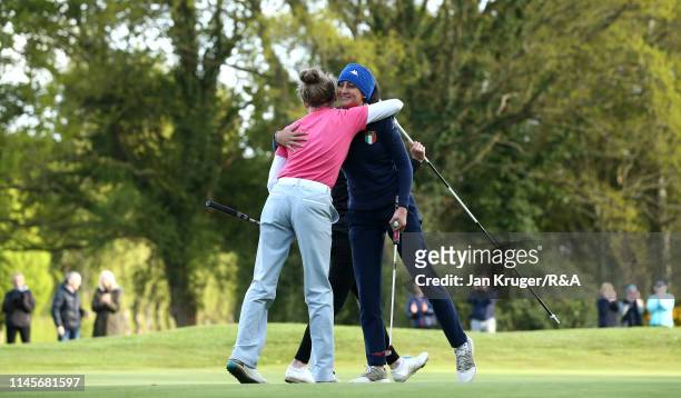 Francesca Fiorellini of Italy is congratulated on the 18th by playing partner Maggie Whitehead during the final round of the R&A Girls U16 Amateur...