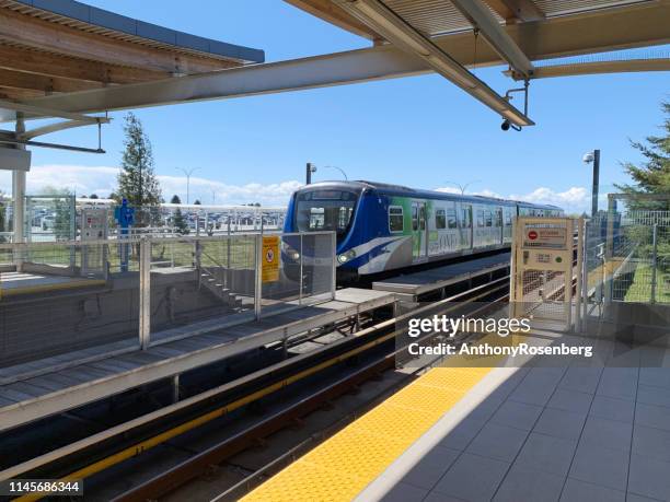 canada line train in vancouver - elevated train stock pictures, royalty-free photos & images