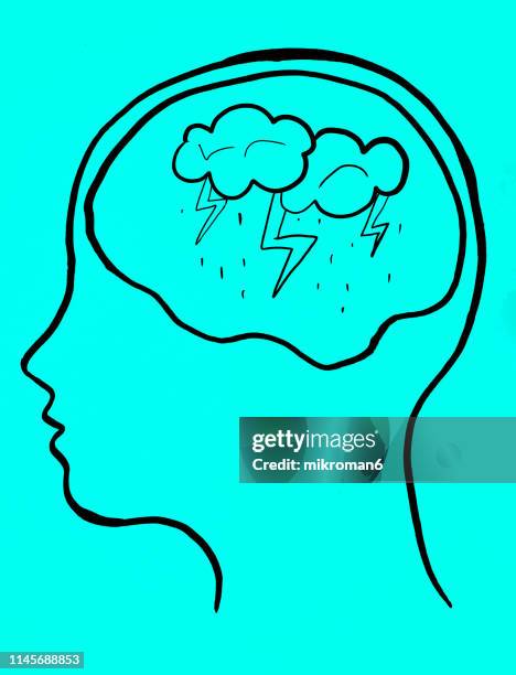 concept art of thoughts inside someones head. rainy stormy weather - climate grief stock pictures, royalty-free photos & images