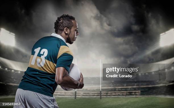 een zwarte rugby speler in een stadion - rugby union competition stockfoto's en -beelden