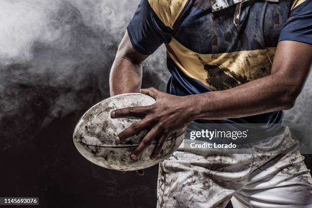 ein blutiger rugby-spieler - rugby ball stock-fotos und bilder