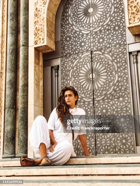 tourist woman at the mosque in casablanca - morocco - morocco tourist stock pictures, royalty-free photos & images