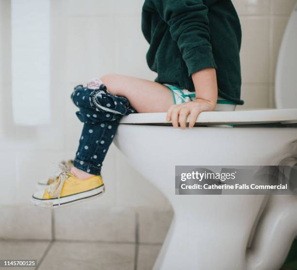 potty training - girls peeing stock pictures, royalty-free photos & images