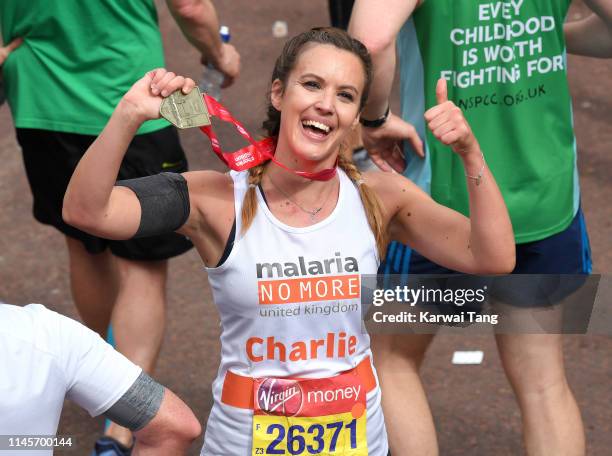 Charlie Webster poses with her medal after completing the Virgin London Marathon 2019 on April 28, 2019 in London, United Kingdom.