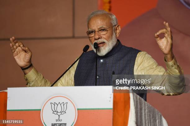 India Prime Minister Narendra Modi gestures as he speaks on stage during his victory speech at the Bharatiya Janta Party headquarters after winning...