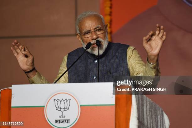 India Prime Minister Narendra Modi gestures as he speaks on stage during his victory speech at the Bharatiya Janta Party headquarters after winning...