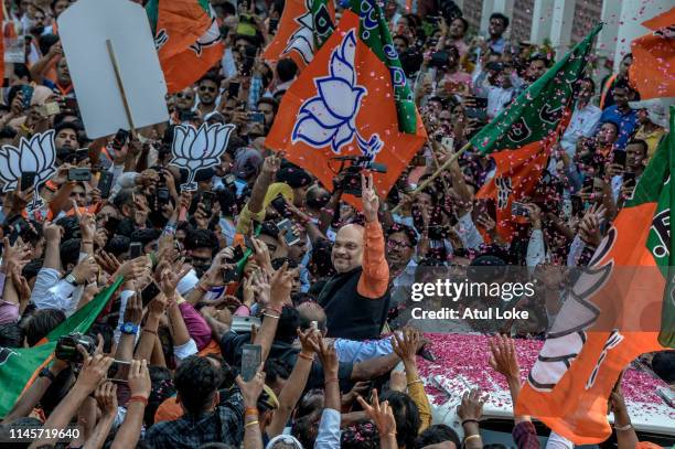 Party president Amit Shah waves at the BJP party workers at BJP party head party workers on May 23, 2019 evening in New Delhi, India.Indian Prime...
