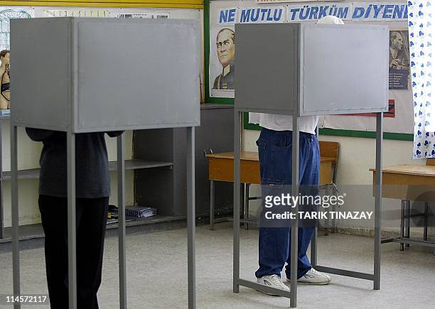 Turkish Cypriots cast their votes in a referendum on a UN peace plan designed to end Cyprus' three decade partition before it joins the European...