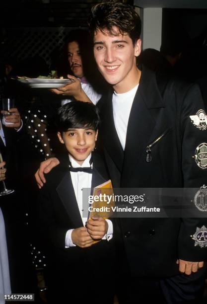 Singer Jonathan Knight of New Kids On The Block posing with a fan, circa 1989.