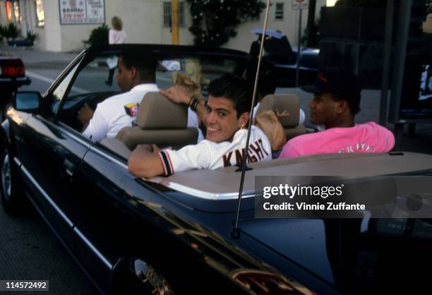 Singer-songwriter Jordan Knight of New Kids On The Block sitting in the back of a Mercedes Benz convertible, circa 1990.