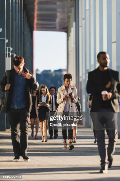 busy people on the move - rush hour stock pictures, royalty-free photos & images