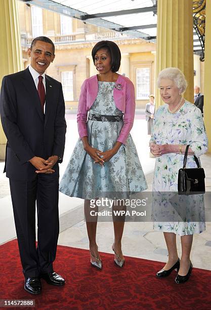First Lady Michelle Obama and US President Barack Obama are greeted by Queen Elizabeth II as they arrive to Buckingham Palace on May 24, 2011 in...
